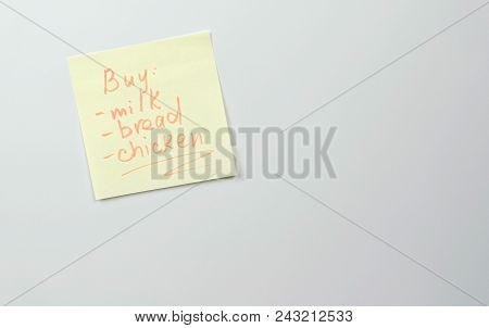 Note On Yellow Sticker Paper Sheets With Words List Of Products Bread Milk Chicken