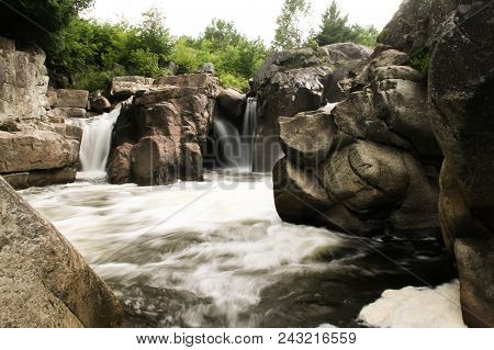 A River With Small Waterfalls Flowing Through A Rocky Canyon.  Adirondack Park, Ny, Usa.