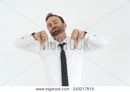 Disappointed Office Worker Expressing His Disapproval. Young Caucasian Man With Conceited Face Point