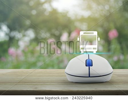 Bus Flat Icon With Wireless Computer Mouse On Wooden Table Over Blur Pink Flower And Tree, Business 