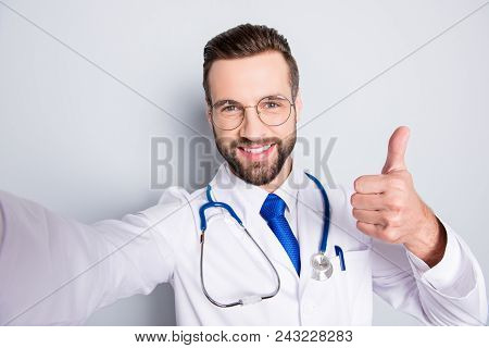 Self Portrait Of Positive Trendy Doc In White Outfit With Tie And Bristle Having Stethoscope On His 