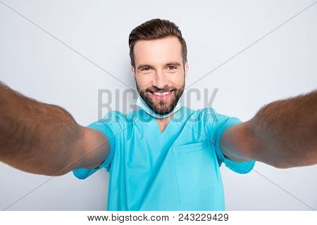 Self Portrait Of Attractive Cheerful Man With Stubble Shooting Selfie With Two Hands On Front Camera