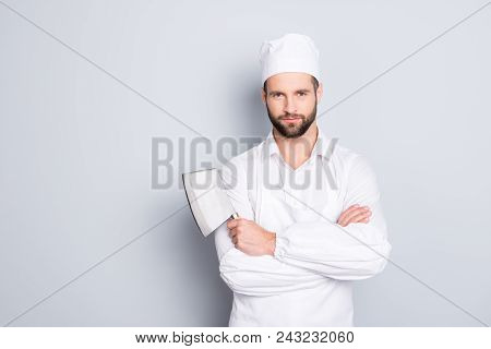 Portrait Of Handsome Attractive Butcher In Beret Having His Arms Crossed Holding Metal Cleaver Looki