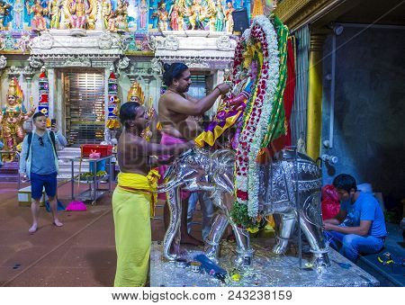 Singapore - Feb 24 : Indian Men Decorating Idol In Sri Veeramakaliamman Temple In Little India, Sing