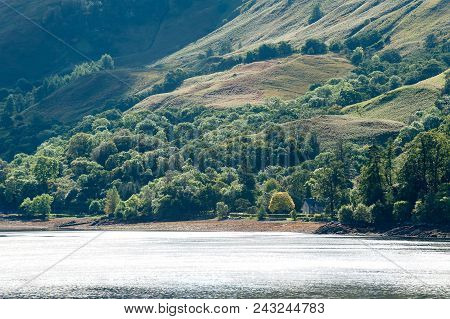 Landscape With Beautiful Green  Scottish Mountains,woodland And Lake With Reflection. Panoramic View