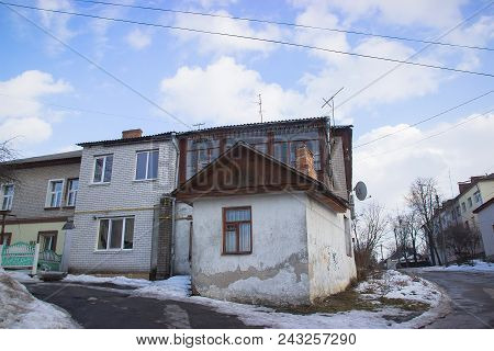 Detail Of An Abandoned Building In Cloudy Sky Landscape