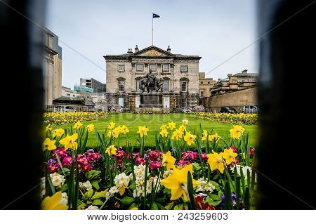 Edinburgh, Scotland - April 27, 2017: Royal Bank Of Scotland Seen Through The Fence, With Flower Gar