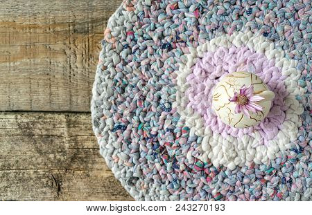 One Lilac Flower Xeranthemum On Round Clay Vase On Knitted Patchwork And Wooden Texture Background C