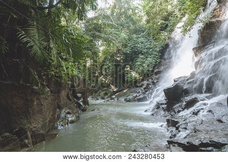 Scenic View Of Beautiful Kanto Lampo Waterfall, Green Plants And Rocks, Bali, Indonesia
