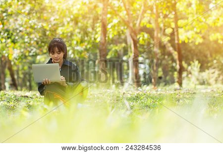Online Education And E-learning Concept: Confident Asian Students Cute Girl  Holding Laptop Computer