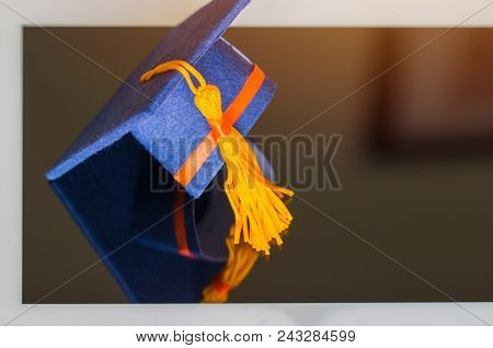 E-learning Online Graduate Education Concept : Graduation Cap, Certificate Degree On Tablet Computer