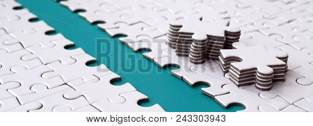 The Blue Path Is Laid On The Platform Of A White Folded Jigsaw Puzzle. The Missing Elements Of The P