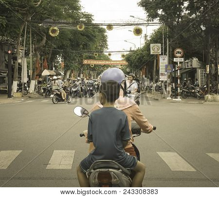 Long Xuyen, Vietnam - Sep 1, 2017. People Riding Motorbike On Street.