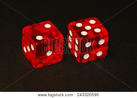 Two Dice On A Black Desk, Result Seven (7), Two (2) And Five (5)