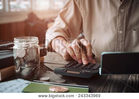 Close Up Asian Business Woman Using A Calculator To Calculate The Numbers.business Finances And Acco