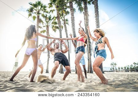 People Having Fun On The Beach