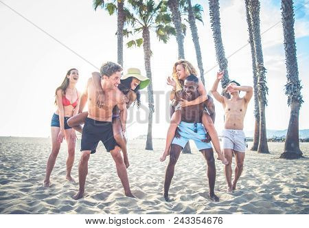 People Having Fun On The Beach