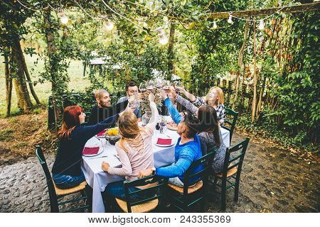 Friends Having Dinner In Garden