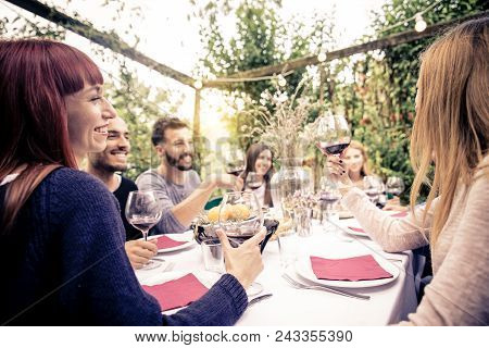 Friends Having Dinner In Garden