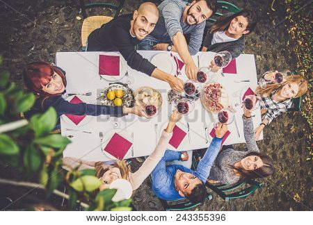 Friends Having Dinner In Garden