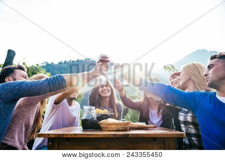 Friends Having Dinner In Garden