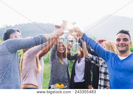 Friends Having Dinner In Garden