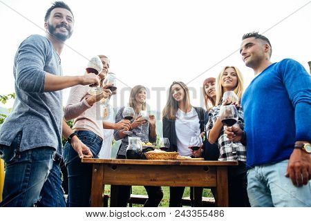Friends Having Dinner In Garden