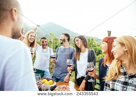 Friends Having Dinner In Garden