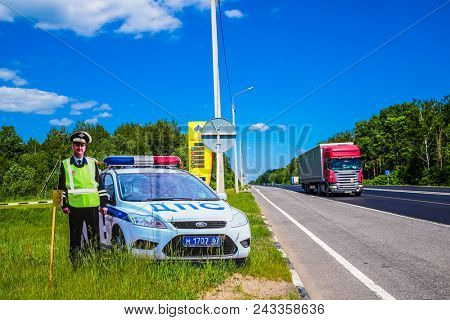Moscow region, Russia - may, 29, 2018: sham policeman on a road wayside. Such models are used by police in Russia to prevent accidents.