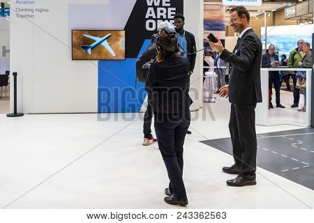 Berlin - April 26, 2018: Stand Of Diehl Aviation. The Visitor Will Test The Virtual Reality System. 