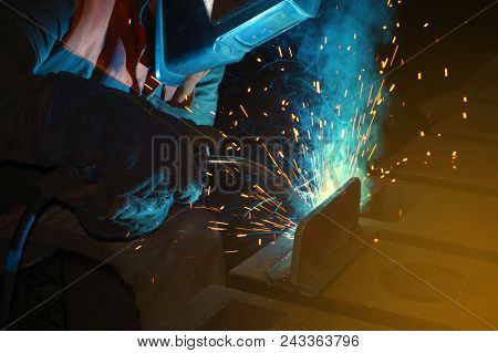 Welder At Work For Close-up Work, Joining Parts With Welding.