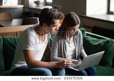 Millennial Couple Shopping Online Paying With Credit Card, Young Customers Making Internet Payment O