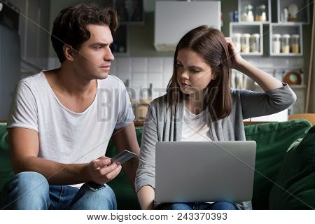Angry Husband Holding Credit Card Blaming Wife Spender Of Overspending Wasting Too Much Money On Onl