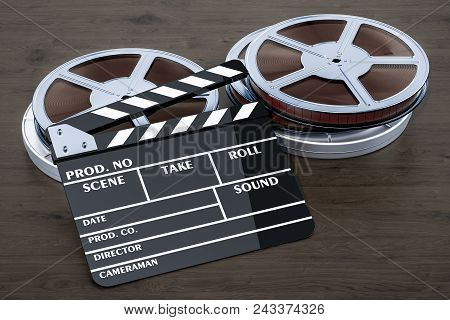 Cinema Concept. Clapperboard With Film Reels On The Wooden Table, 3d Rendering