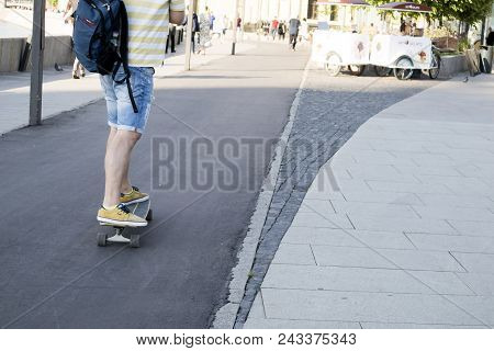 Moscow, Russia - May19, 2018: The Legs Of A Man In Sneakers, Who Rides A Skateboard At The Museon In