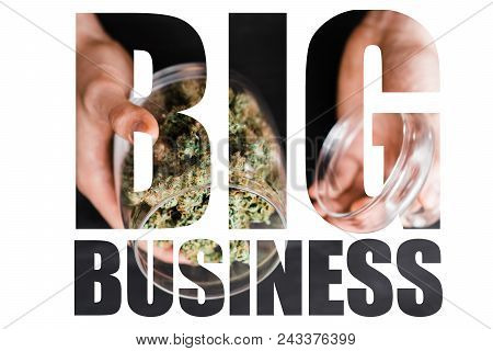A Can With Buds Of Cannabis In The Hands Of A Man. The Concept Of Legal Marijuana Is Medical Weed. O