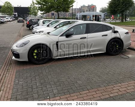 Lelystad, Netherlands - June 3, 2018: Porsche Panamera 4 Electric Car Being Charged At A  Charging P