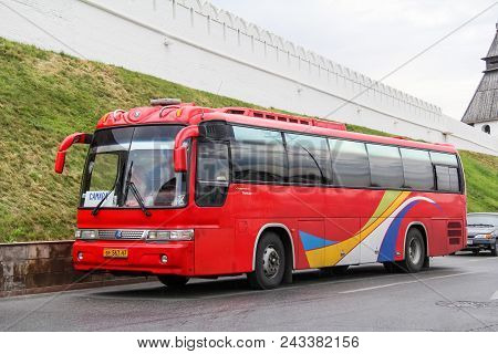 Kazan, Russia - August 20, 2011: Red Touristic Coach Bus Kia Granbird In The City Street At The Back