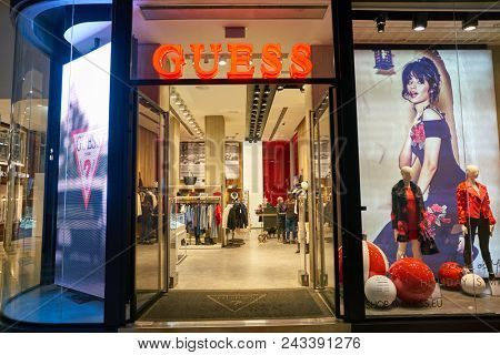 MILAN, ITALY - CIRCA NOVEMBER, 2017: entrance and window display at Guess store in Milan. Guess is an American clothing brand and retailer.