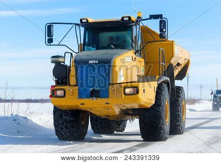 Novyy Urengoy, Russia - April 5, 2014: Yellow Articulated Dump Truck Bell B40d At The Interurban Roa