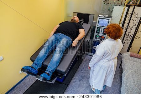 Doctor And Male Patient At Non-surgical Treatment Of Cervical And Thoracic Spine In Medical Center.