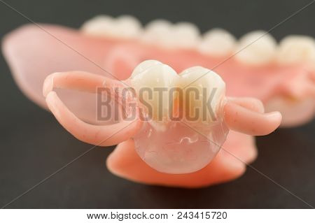 Large Image Of A Modern Denture On A Black Background
