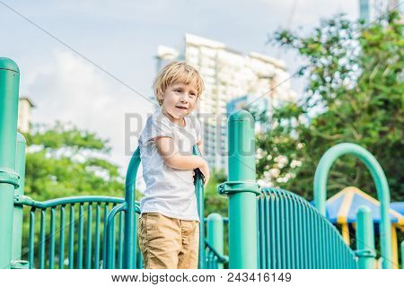 Funny Cute Happy Baby Playing On The Playground. The Emotion Of Happiness, Fun, Joy.