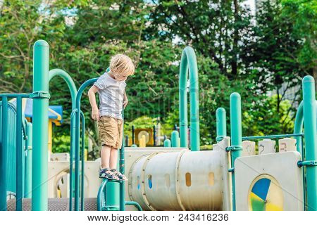 Funny Cute Happy Baby Playing On The Playground. The Emotion Of Happiness, Fun, Joy.
