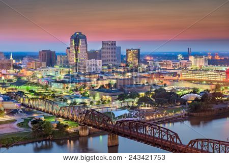 Shreveport, Louisiana, USA skyline over the Red River at dusk.