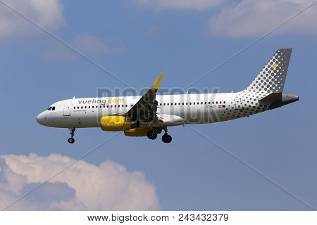 Borispol, Ukraine - May 25, 2018: Ec-mge Vueling Airbus A320-200 Aircraft On The Cloudy Sky Backgrou