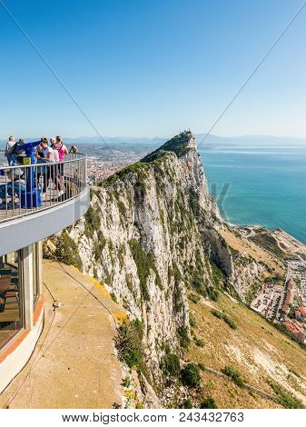 Gibraltar, Uk - May 18, 2017: Tourists And Barbary Apes On The Viewing Platform With The Rock And Th