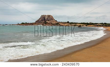 Beach With Single Hill (patanangala Rock) In Distance On Overcast Day. Yala National Park, Sri Lanka