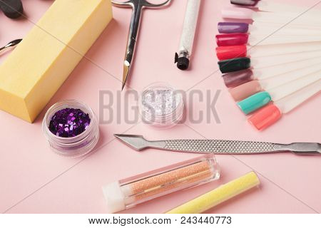Manicure And Pedicure Beauty Accessories On Pink Background, Copy Space. Nail Polish Samples, Scisso