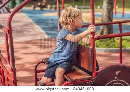 Funny Cute Happy Baby Playing On The Playground. The Emotion Of Happiness, Fun, Joy.